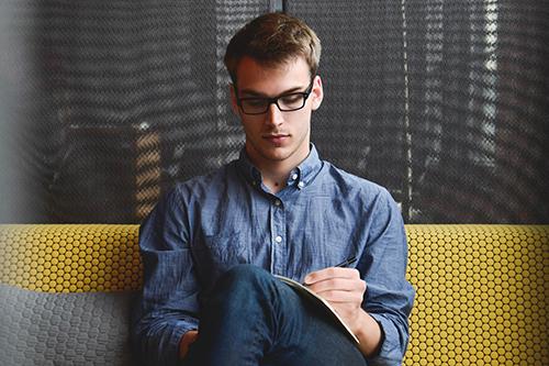 man working on couch